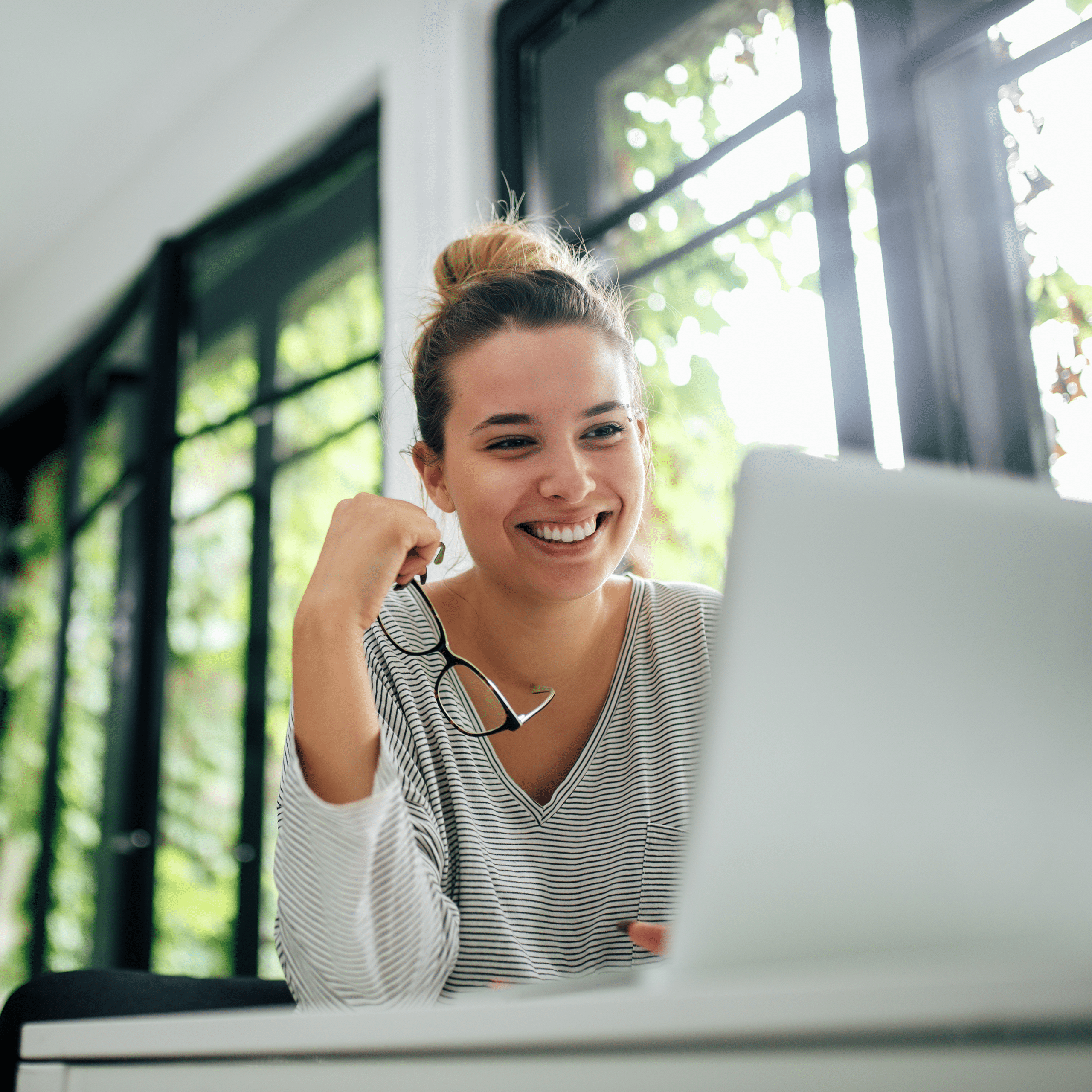 A Woman looking at a laptop